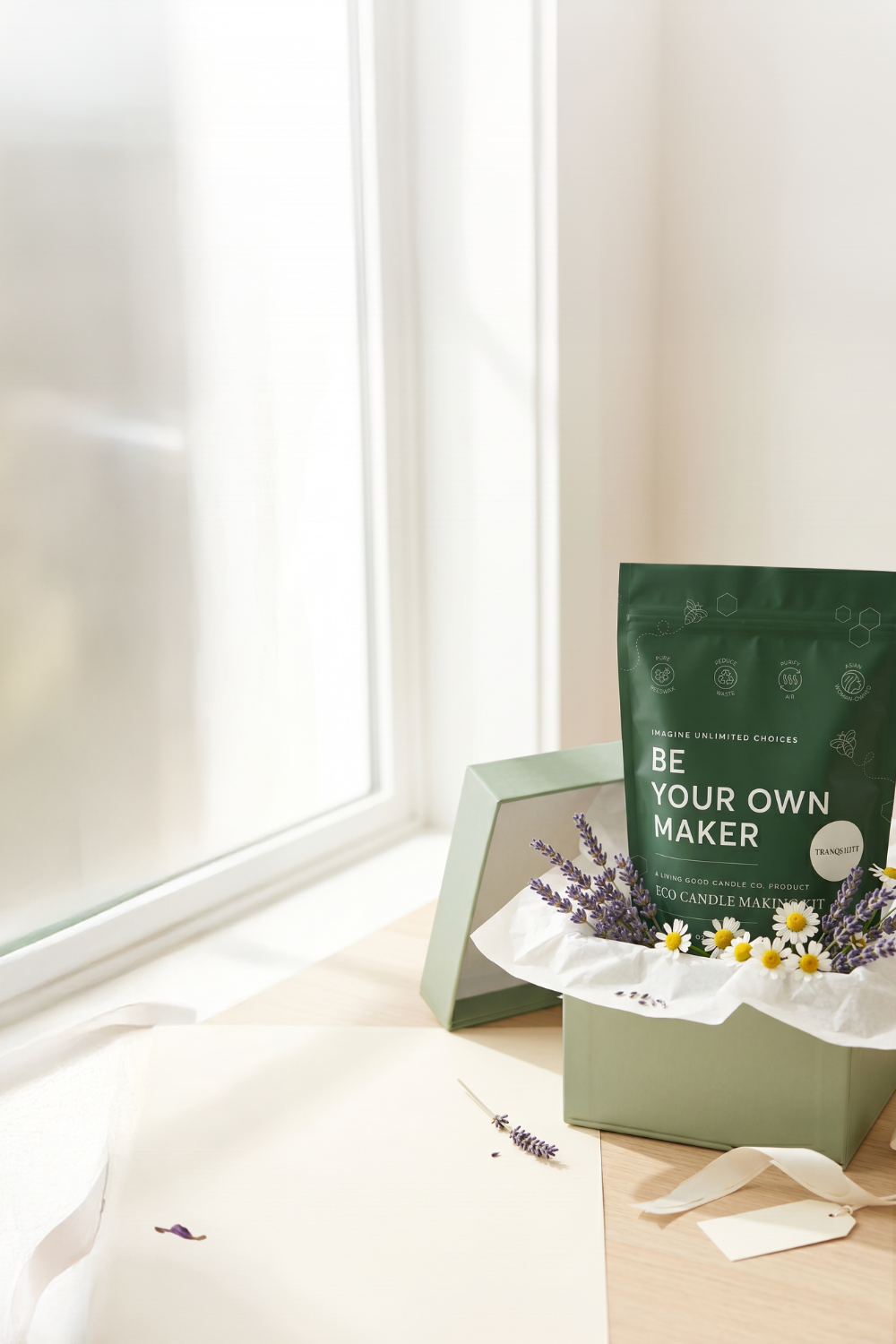 Living Good Candle Co. Eco Candle Making Kit presented in a gift box with lavender and flowers for a handmade candle gift.