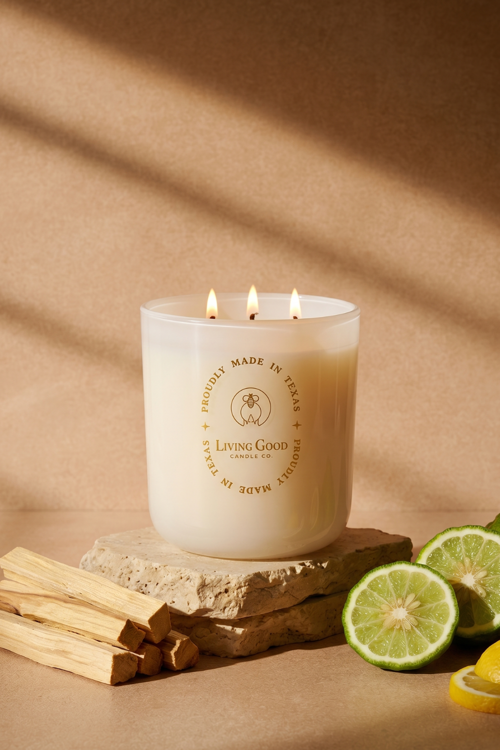 Living Good Candle Co. 15 oz Palo Santo three-wick beeswax candle with bergamot citrus and Palo Santo wood.