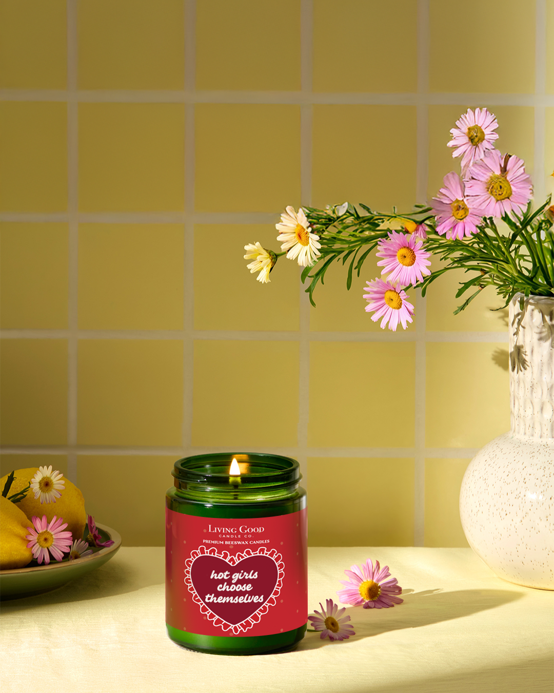 Living Good Candle Co. 5.5 oz personalized message beeswax candle in a small green jar, styled as a thoughtful housewarming gift.