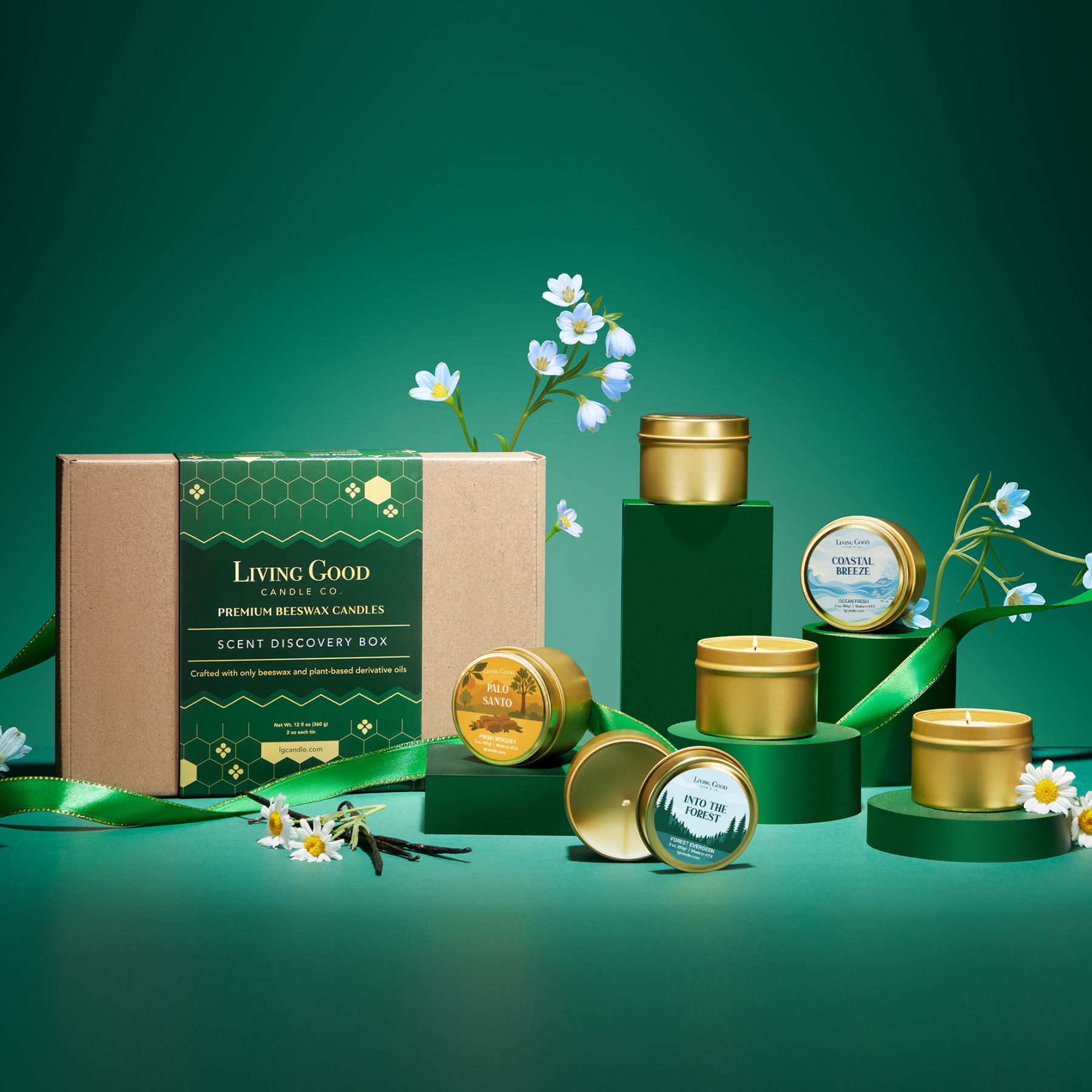 Living Good candle set with green and gold containers on a green background