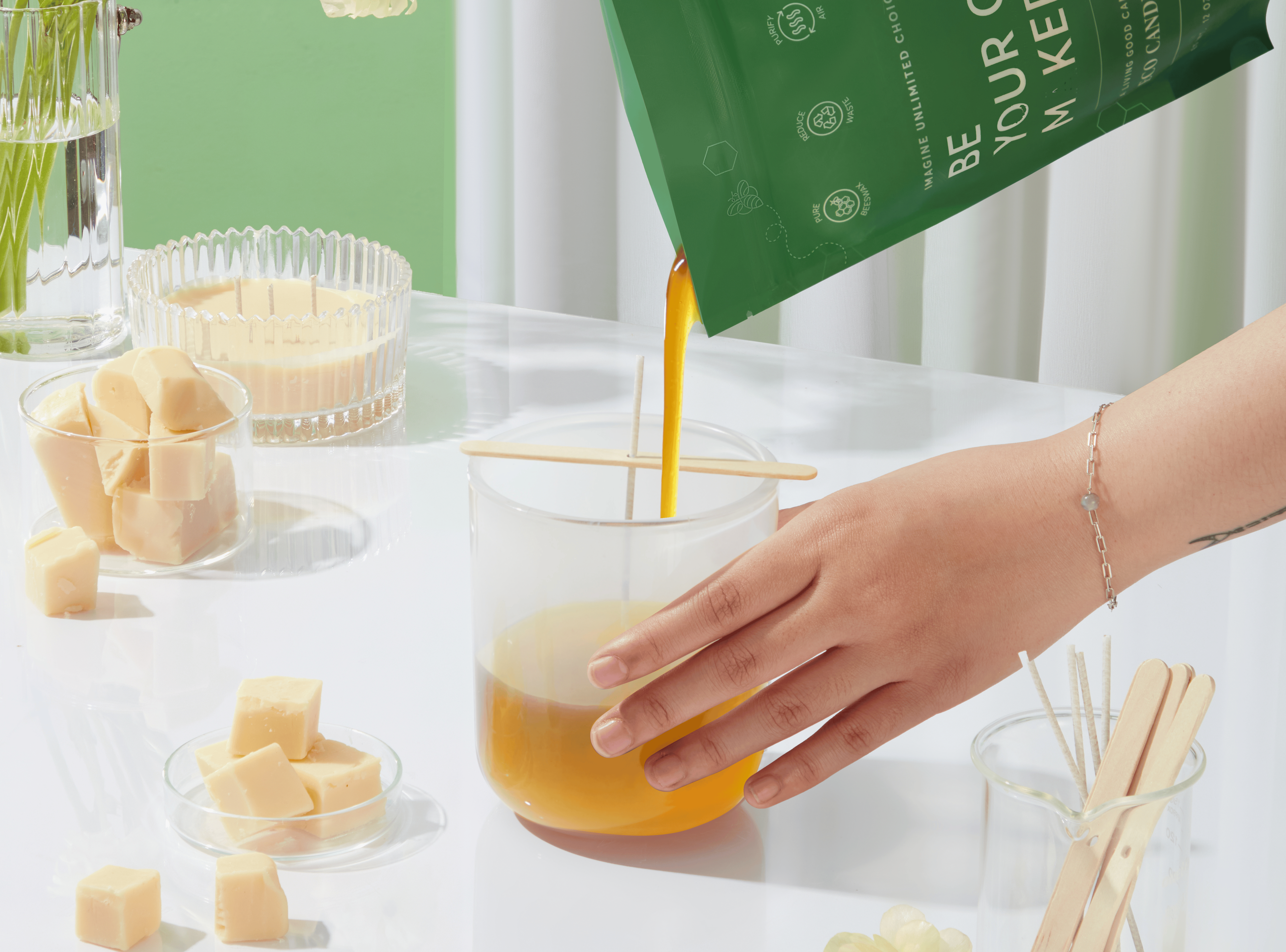 Eco DIY candle kit with beeswax and plant-based oils – wax being poured into a jar for easy at-home candle making
