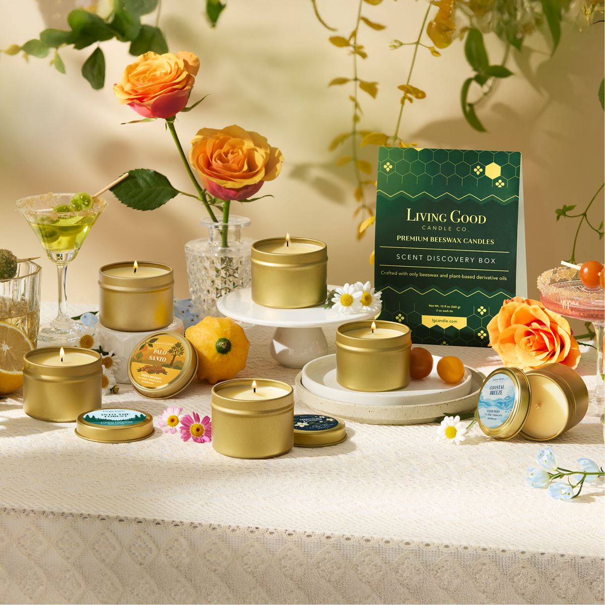 Scent Discovery Box with six mini beeswax candles displayed with flowers, citrus, and seasonal decor.