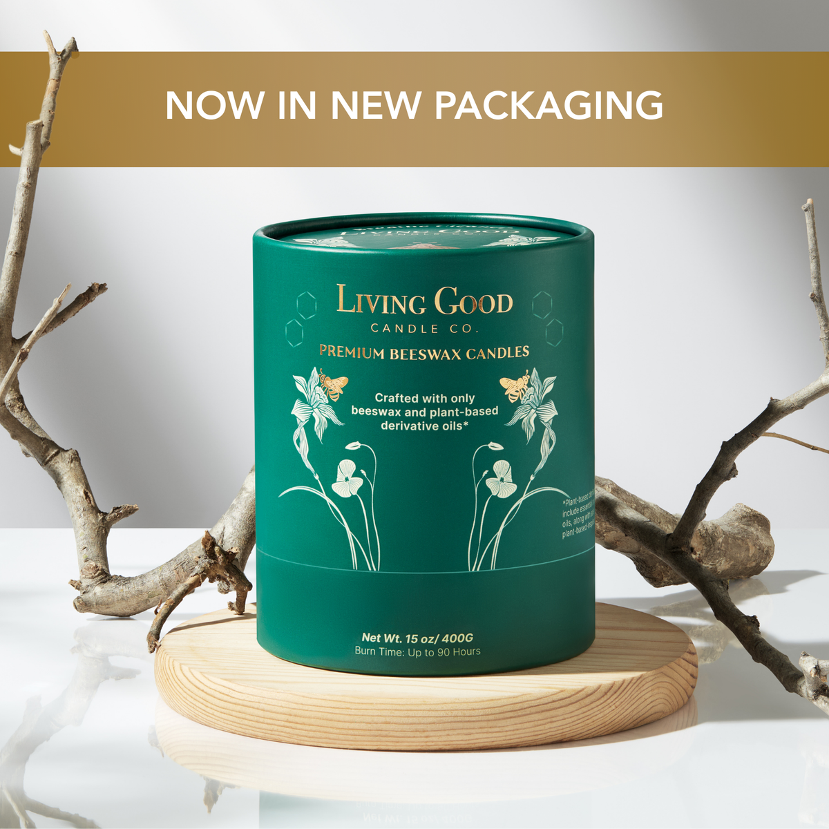 Cinnamon Delight beeswax candle in new green packaging displayed on a wooden stand