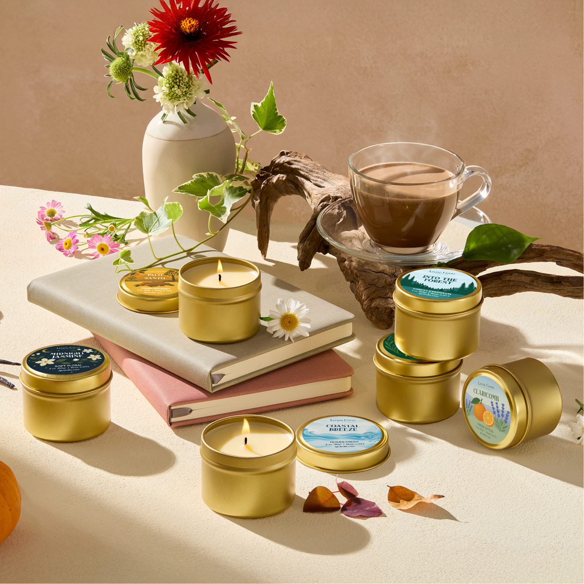 Assorted mini beeswax candles from the Living Good Candle Co. discovery set styled with books, flowers, and coffee.