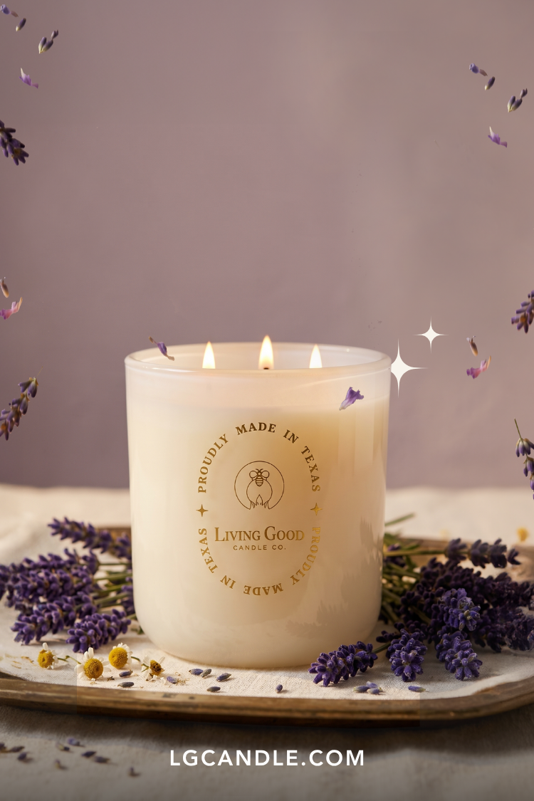 Living Good Candle Co. 15 oz three-wick beeswax candle styled with lavender to represent essential oils and plant-based natural isolates.