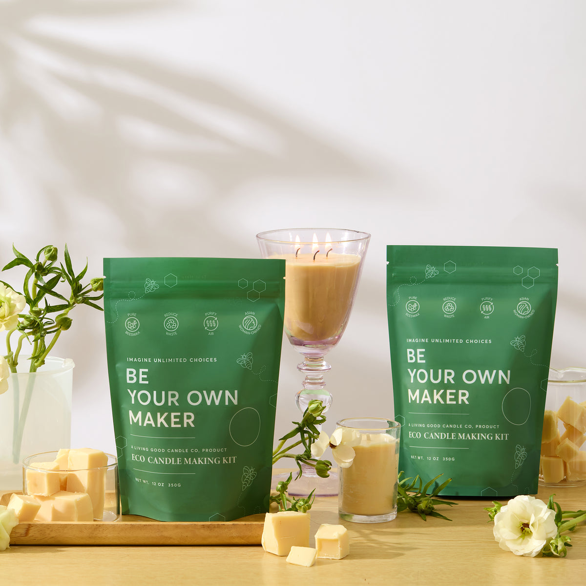 Claricomb beeswax candle refill kit displayed beside finished candles in glass containers