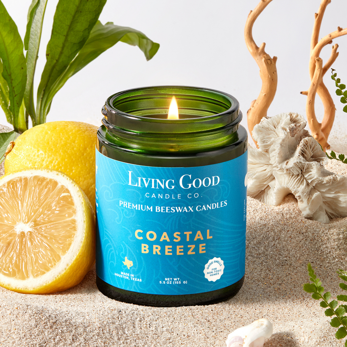 Living Good Candle Co. Coastal Breeze 5.5 oz beeswax candle with lemon, sand, driftwood, and coastal decor