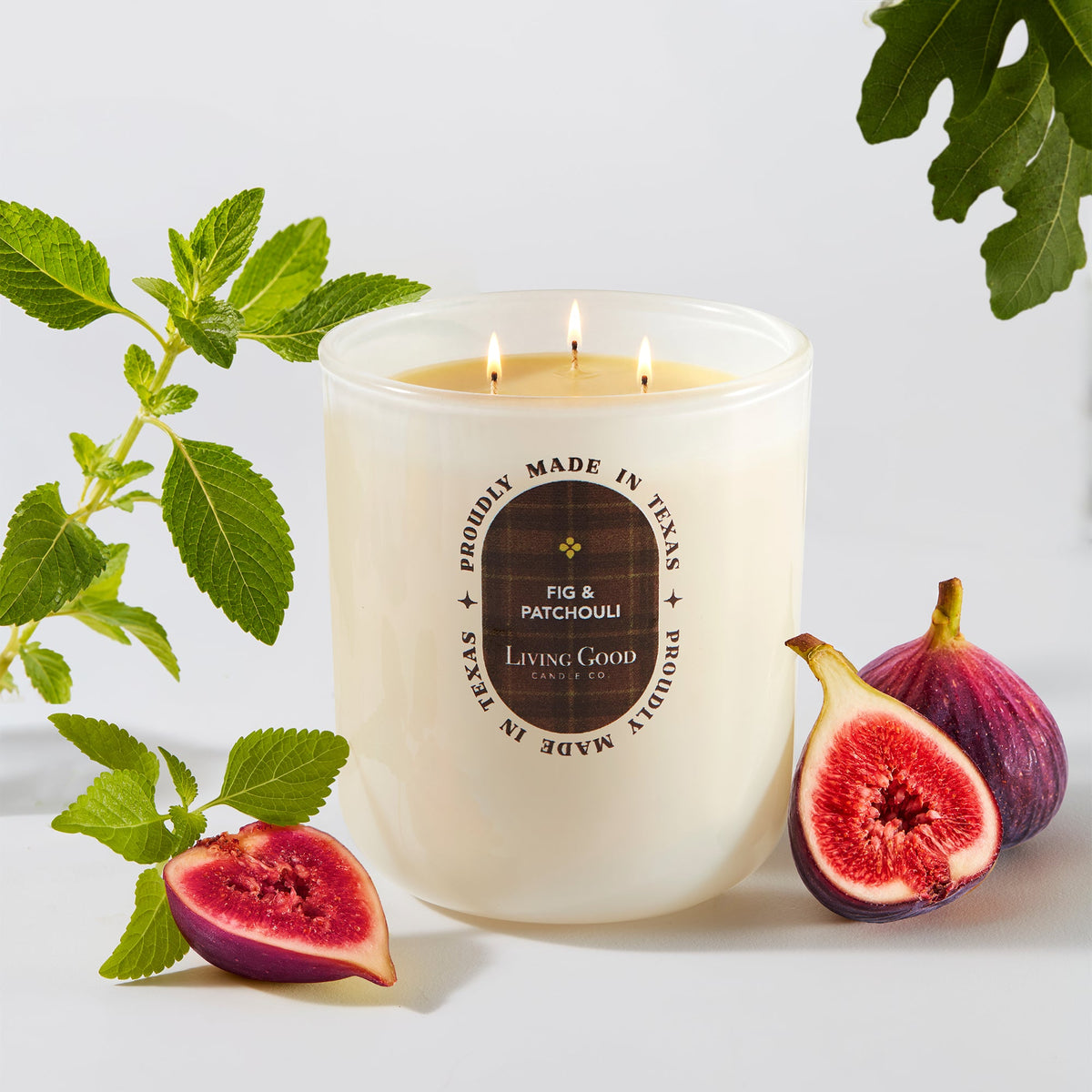 Fig and Patchouli candle with fresh figs and mint leaves, Living Good Candle Co.