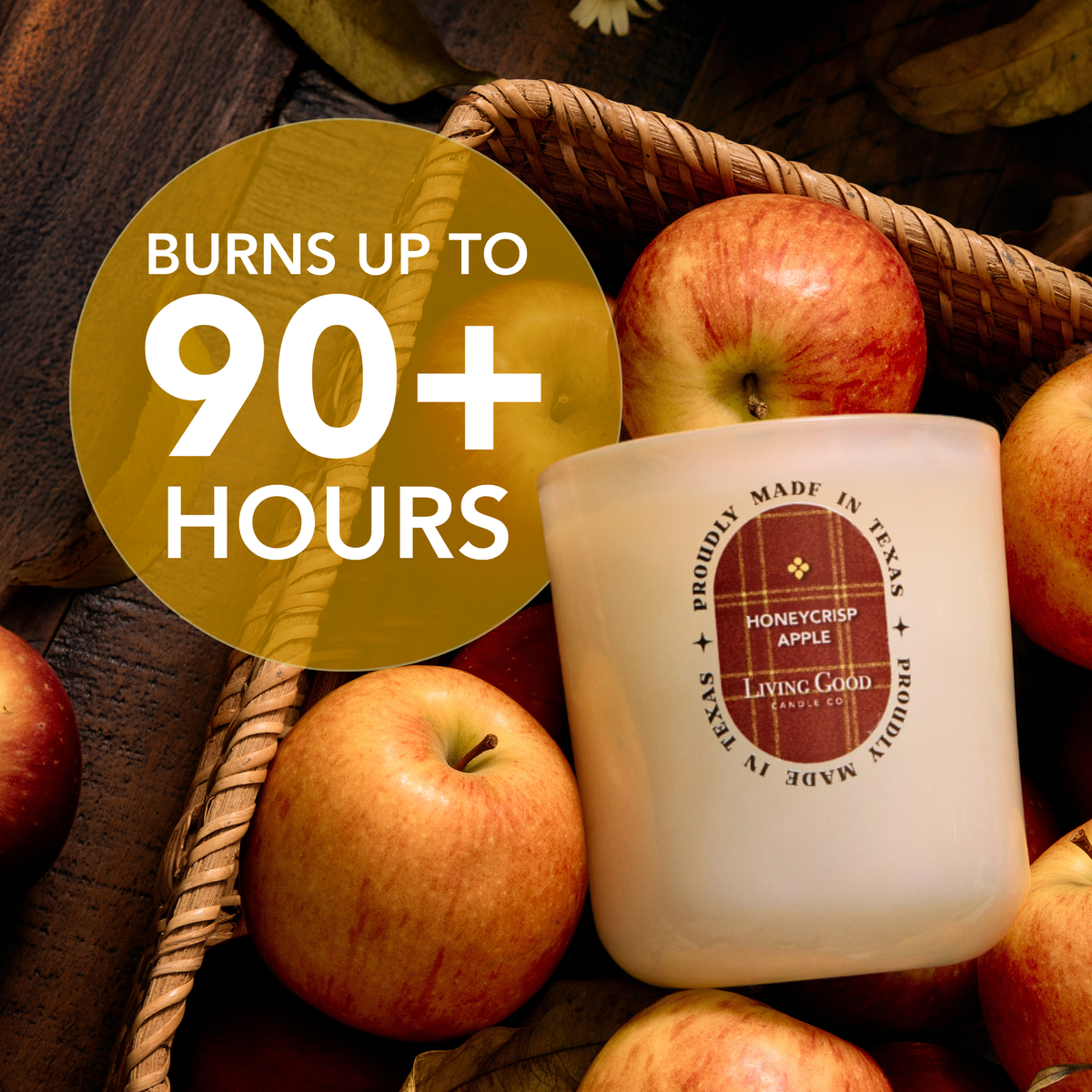 Living Good Candle Co.'s Honeycrisp Apple 15 oz beeswax candle displayed with fresh apples and a burn time of up to 90+ hours.