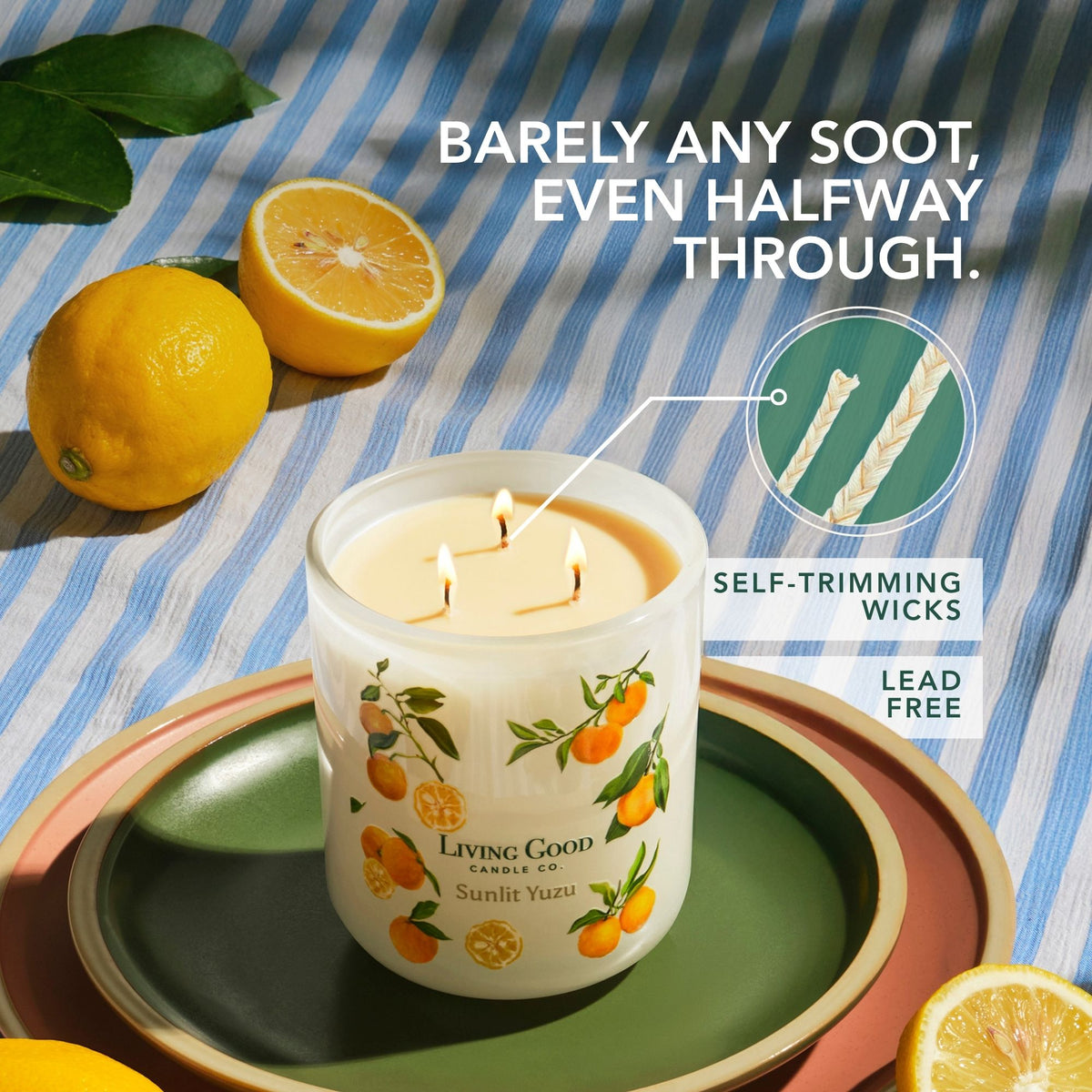 Lit Sunlit Yuzu beeswax candle showing self-trimming lead-free wicks and barely any soot halfway through the burn.